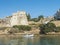 View of medieval fort Forte de Sao Clemente over the Mira river with small boat in sunny day with clear blue sky. Vila