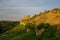 A view of the medieval Izborsk fortress walls and towers in suns