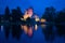 A view of the medieval Olavinlinna fortress of the blue August night. Savonlinna, Finland