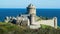 View on medieval sandstone castle from 13th century on cliff at atlantic ocean against dizzy sky - Fort la latte, Cap Frehel,