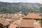 view of medieval tiled roofs of stone houses with windows and wo