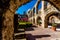 View of the Meditation Garden Through an Old Stone Arch at the Historic Old West Spanish Mission San Jose