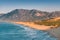 view of the Mediterranean seacoast at the Patara beach during high tide with waves. High mesmerizing mountain in the