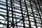 A view of the metal structures of the windows of the airport waiting room.