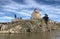 View of Metekhi Church and chapel of st. Abo Tbileli with monument of King Vakhtang I Gorgasali founder of the city Tbilisi,