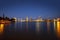 View of Miami at sunset, USA. Miami city skyline panorama at dusk with urban skyscrapers and bridge over sea with