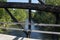 View of middle fork river through bridge beams