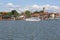 View from MikoÅ‚ajskie Lake of town, marina for yachts and boats at the waterfront, Mikolajki, Masuria, Poland