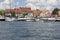 View from MikoÅ‚ajskie Lake of town, marina for yachts and boats at the waterfront, Mikolajki, Masuria, Poland