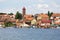 View from MikoÅ‚ajskie Lake of town, marina for yachts and boats at the waterfront, Mikolajki, Masuria, Poland