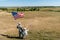 View of military father and patriotic child holding american flags