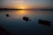 View of the Minho River at amazing sunset, silhouettes of fishing boats on the border between Portugal and Spain.