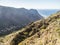 View from Mirador Cesar Manrique of canyon Barranco del Valle Gran Rey. Green valley with palm trees, terraced fields