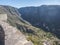 View from Mirador Cesar Manrique of canyon Barranco del Valle Gran Rey. Green valley with palm trees, terraced fields