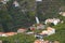 View from Miradouro da Torre viewpoint of a village in Madeira with a waterfall