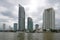 View of modern high-rise buildings on the river side of the Chao Phraya gloomy cloudy day. Bangkok,Thailand