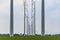 A view between the modern high voltage pylons in the meadows near Alphen aan de Rijn, the Netherlands
