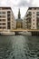 View of a modern residential district of Copenhagen, Denmark, with the canal, moored boats and buildings of contemporary architect