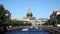 View of Moika river embankments, domes of St. Isaac`s Cathedral and tourist boats, Saint Petersburg,