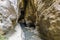 A view of the Monachil river entering a tunnel in the Sierra Nevada mountains, Spain