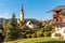 View of the Monguelfo-Tesido village with the bell tower of the Parish Church of Saints Ingenuino and Albuino, South Tyrol, Italy