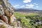 View of Montagu Springs valley and Mountain range with large red rocky outcrops and lush green vegetation, Montagu Springs