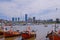 The view of Montevideo skyline from Buceo Port Pier Harbor crowed of small fishing boats and ships, Montevideo Uruguay