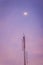 View of the moon on the dusk sky and the folded dipole radio ant