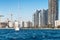 View of a moored yacht in front of Limassol cityscape. Cyprus