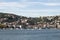 View of moored yachts on Bosphorus and Bebek neighborhood on European side of Istanbul. It is a sunny summer day.