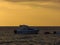 View of a motorboat docked at the shore of Ksamil beach