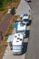 View of motorhomes parked on the side of the road in foreign tourists campsite