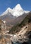 View of mount Ama Dablam with stony and wooden bridge