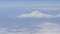 View of Mount Ararat from an airplane. Snow-capped mountain top. Biblical mount Ararat taken from the Airplane