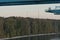 View on Mount Hood above Hayden Island covered with trees and bushes from the Portland container Terminal