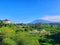 view of Mount Manglayang, buildings, and Jatinangor rice fields in the morning