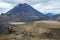 View of Mount Ngauruhoe - Mount Doom from Tongariro Alpine Crossing hike with clouds above