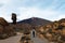 View of Mount Teide during a cloudy day with a person walking, Tenerife