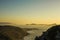 View from the mountain of a beautiful sunset over the sea with the cies islands in the background