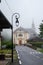 View on mountain chapel in foggy small village near Saint-Gervais-les-Bains, Savoy, France