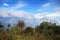 View of the mountain through a grass. Clouds got stuck on the mountain. Turkish landscape