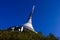 View of a mountain hotel and a television transmitter