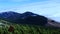 View of mountain landscape. A mist rising from the valley in the distance.