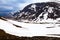 View from a mountain passage, tourists, snow