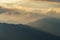 View of a mountain range in the Alps of Europe during sunset. Slopes in Autumn