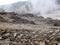 A view of the mountain slopes covered with landslides of stones and soil after a rock fall