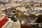 view from the mountain to Jerusalem in cloudy weather. Cars, light stone houses, solar panels on rooftops