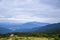 View from the mountain to the ski resort Dragobrat. Hoverla and petros mountines on background. Carpathian mountains