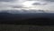 View from the mountain top on a beautiful forested valley. Clip. National park with green hills on cloudy sky background