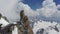 View of mountaineers climbing on a rock near the Aiguille du Midi in the Mont Blanc massif, France, Europe